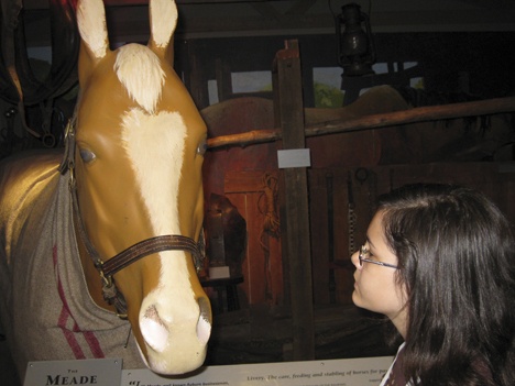 Autumn McCullough studies The Meade exhibit at the White River Valley Museum