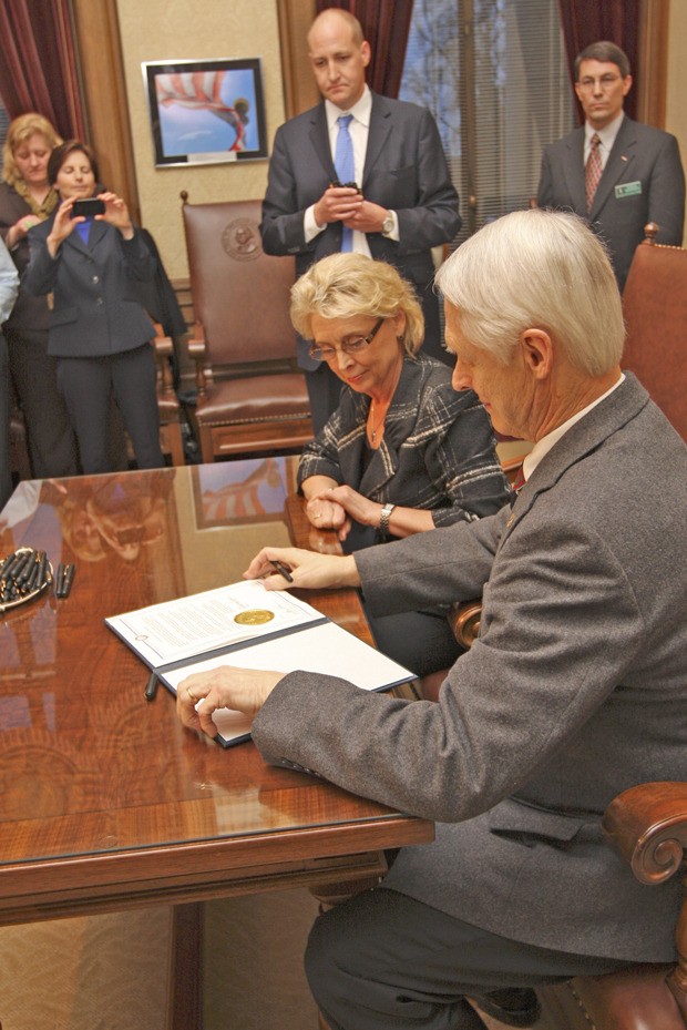 Gov. Gregoire and Secretary of State Sam Reed sign the R-74 proclamation in Olympia on Wednesday afternoon.