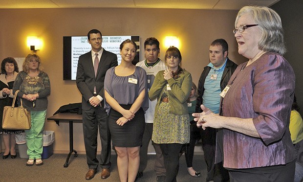 Trillium Executive Director Trish Borden addresses the gathering