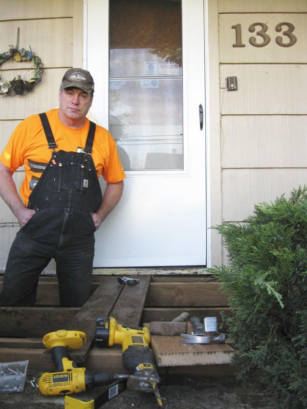 Rich Hildreth and volunteers replaced Yvonne Slaby's worn front porch.