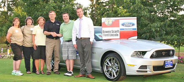 Rick Grady won the hole-in-one contest and a new car