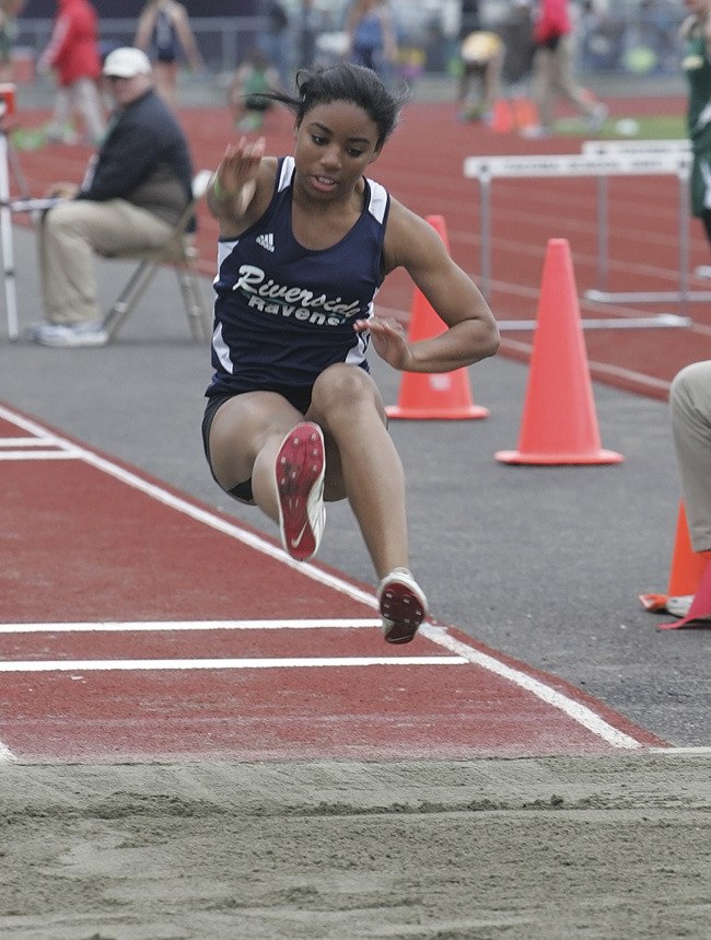 Auburn Riverside sophomore Brandi Williams competes in the long jump at the district meet.