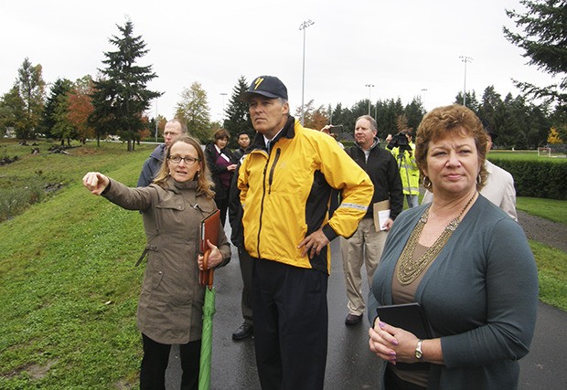 King County Senior Ecologist Sarah McCarthy points out work that was done on the Reddington levee to Gov. Jay inslee