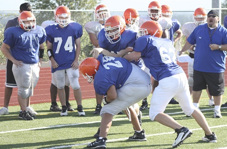 Lineman go through some drills during camp at Auburn Mountainview High School.