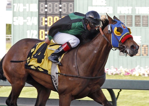 E Z Kitty and jockey Leonel Camacho-Flores led all the way in the $50