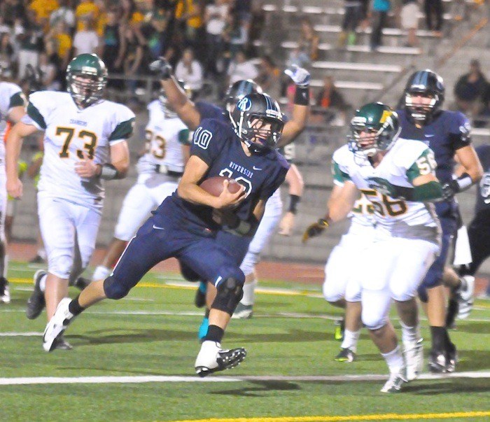 Auburn Riverside's Kevin Thomson scampers for a few yards against Kentridge.