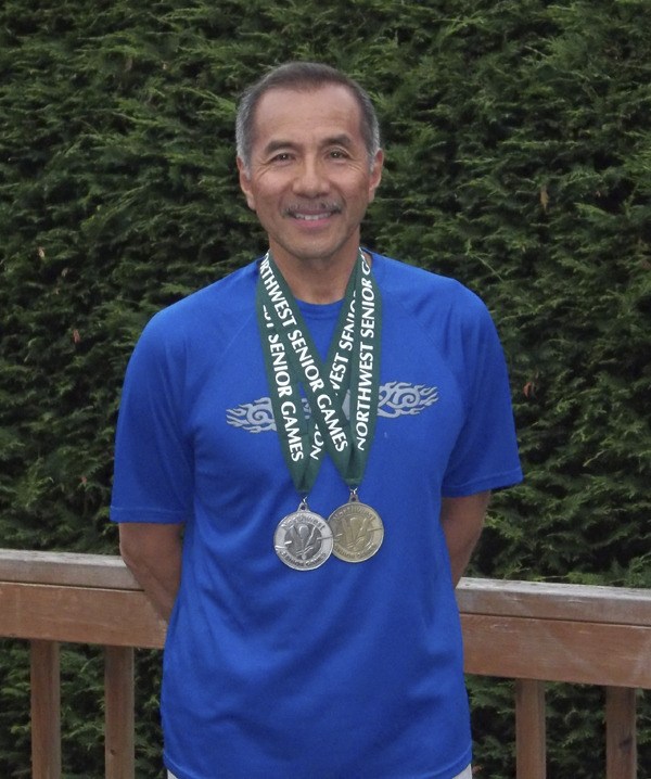 Sensei James Penor poses with his Northwest Senior Games track and field