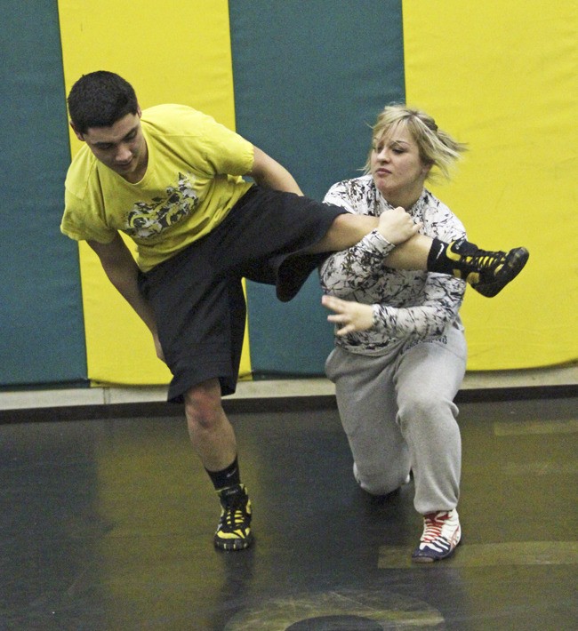 Katrynia Todd practices with teammate Jose Valenzuela.