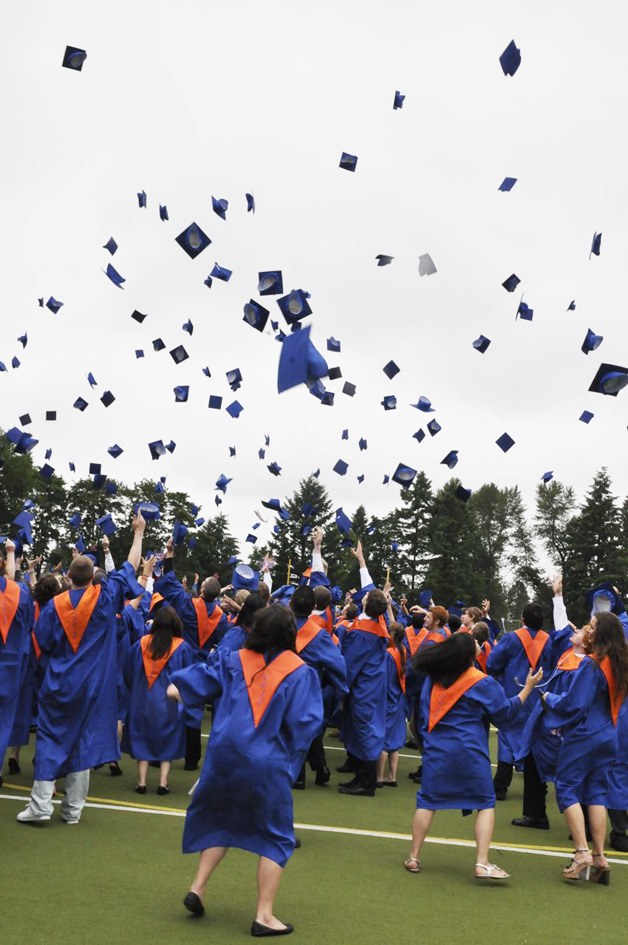 Seniors from Auburn Mountainview High School toss their caps into the air at the end of graduation ceremonies at Auburn Memorial Stadium last Saturday. Auburn’s four classes of 2010 – Auburn