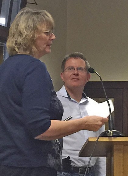 Pacific Mayor Leanne Guier presents a plaque to outgoing Councilmember Joshua Putnam for his years of service.