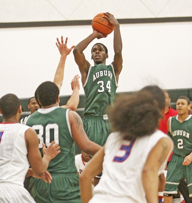 Iszia Johnson elevates for a shot during Auburn's 63-62 win over Kent-Meridian on Tuesday.