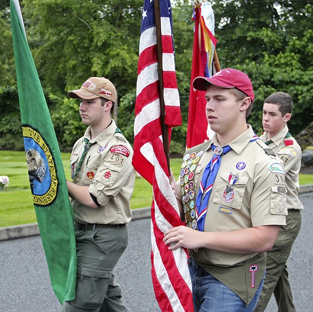 Boy Scout Troops 398 and 401 participate in Auburn’s Memorial Day service at Mountain View Cemetery’s Memorial Flag Plaza on Monday. The community – including VFW Post 1741