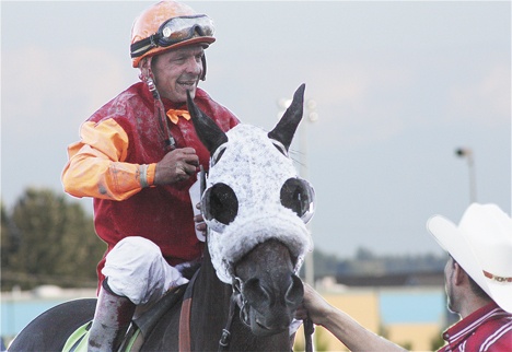 Jockey Gallyn Mitchell comes to victory circle after guiding Assessment to victory in the 74th running of the Longacres Mile last Sunday. The venerable Mitchell drove the Howard Belvoir-trained