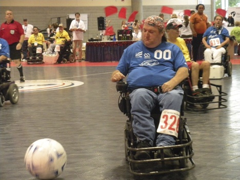 Patrick Carpenter chases down the ball during a power soccer match at this year’s Veteran’s Wheelchair games in Spokane.