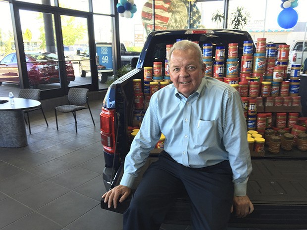 Way Scarff and his Auburn dealership have given back to the community in many ways. Ford dealerships throughout the area encourage the public to donate jars of peanut butter in a campaign to help feed the region's hungry youth.