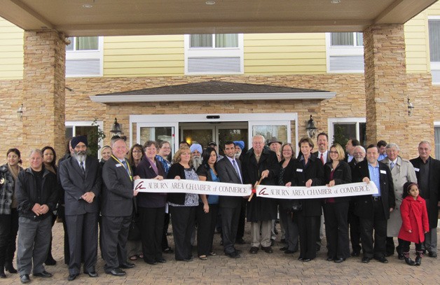 Mayor Pete Lewis joined Auburn Area Chamber of Commerce members and the staff of the La Quinta Inn & Suites for a ribbon-cutting ceremony on Monday.