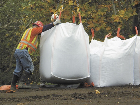 Crews were busy positioning giant sandbags along the Green River to reinforce certain levees.