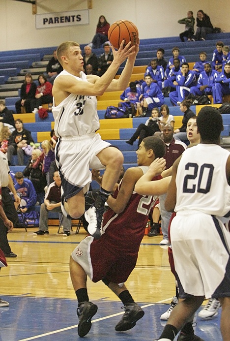 Senior wing Ryan Rogers in flight against Cascade High School this past week.