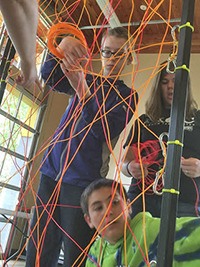 Hanging electroluminescent (EL) wire artwork is part of the workshop.