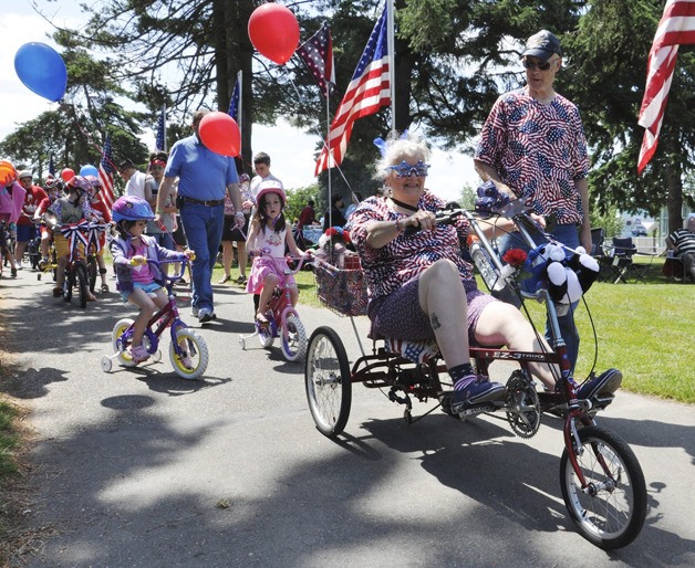 Mike and Carol Oneal lead the Fourth of July Parade.