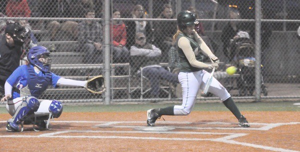 Auburn's Katie Porter rips a triple during the Trojan's 10-run explosion in the sixth inning against Auburn Mountainview.