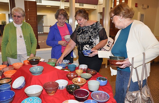 People shop during the Empty Bowls event at Grace Community Church.