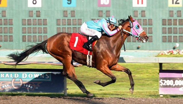 Touch the Sun and jockey Isaias Enriquez team up for the victory in the feature race for 3-year-olds and up Saturday at Emerald Downs.