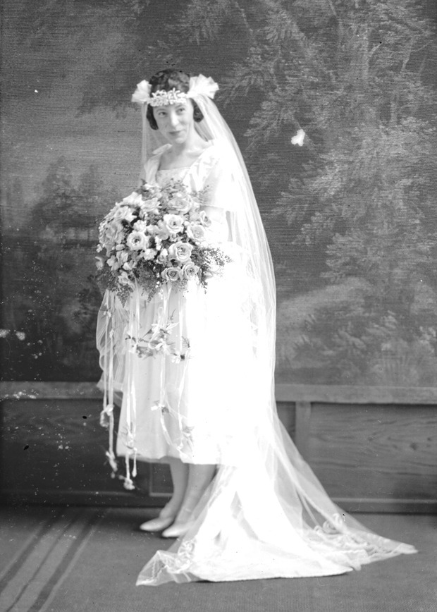 I Do! uses antique wedding gowns and accessories to explore the histories and myths surrounding the customs of the American white wedding.