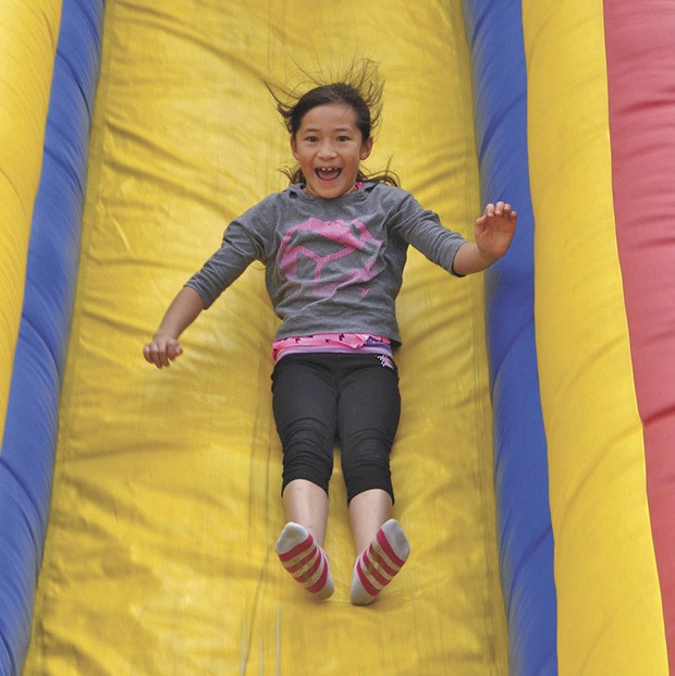 Good times: There are plenty of slides and rides for children at Friday’s KidsDay event at Les Gove Park.