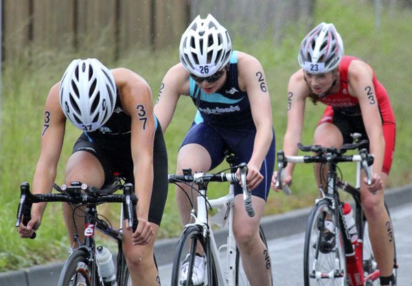 Two RockSteady Youth Triathlon club members lead the pack during the biking portion of a race.