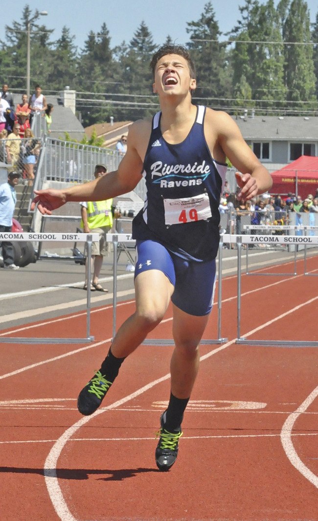 Andrey Zadneprovskiy finishes the 300-meter hurdle race at the Washington State 4A Boys Track and Field Championships at Mount Tahoma High School in Tacoma. Zadneprovskiy