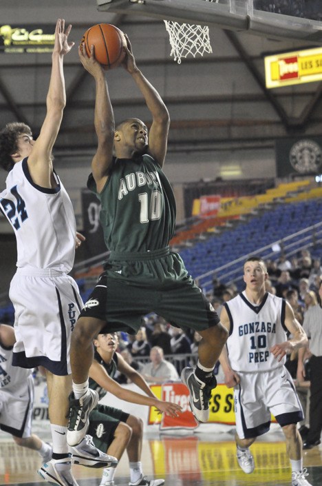 Auburn's Jodeci Johnson battles Gonzaga Prep's Chris Sarbaugh for the ball.