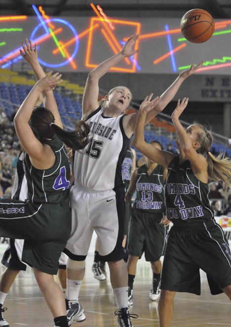 Auburn Riverside's Kara Jenkins reaches for a rebound against Edmonds-Woodway. Jenkins stepped up big for the Ravens