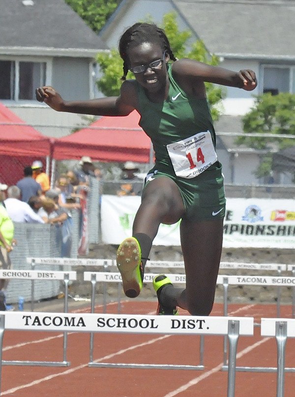 Rebecca Thareek runs the 300 hurdles at the Washington State 3A track and field championships