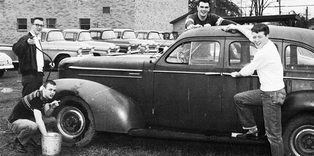 Boys polish their car as seen in the 1958 Auburn High School Invader.