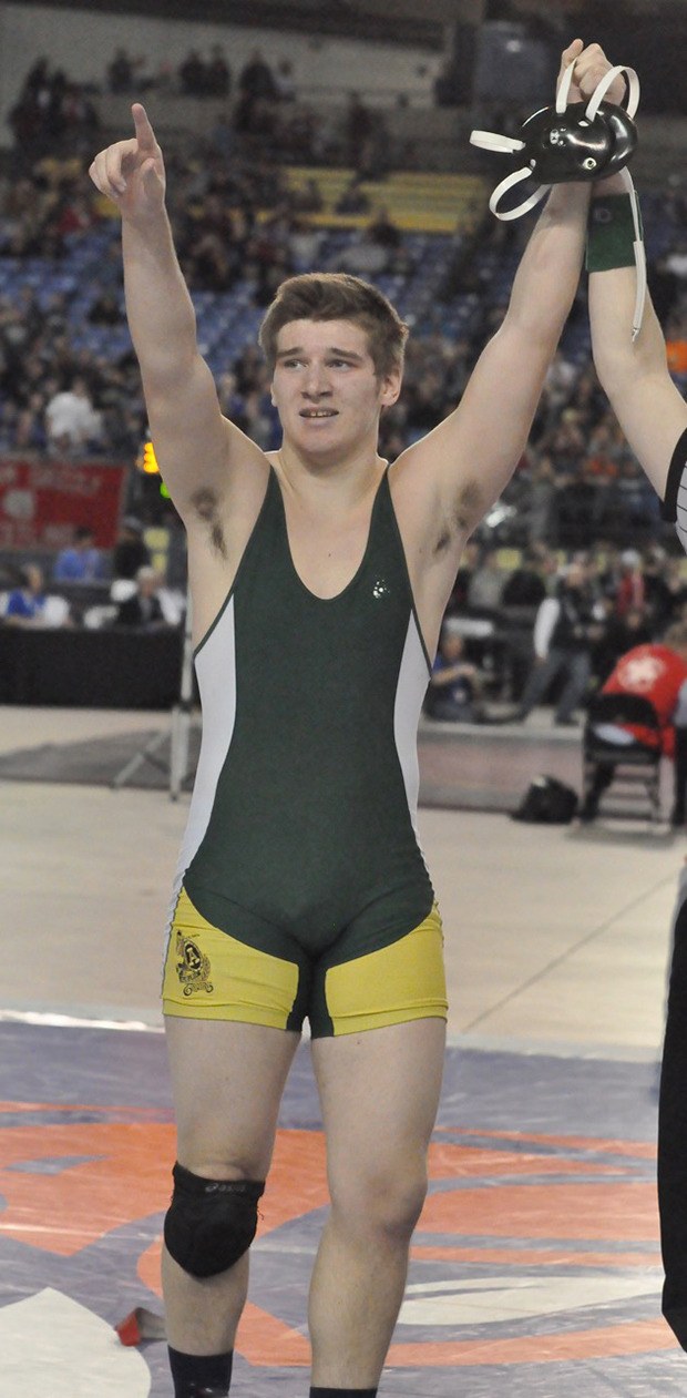 Auburn's Kyle Guthrie celebrates after the 220-pound senior pinned Lincoln's Will Willsey for the title at Mat Classic XXVIII at the Tacoma Dome.