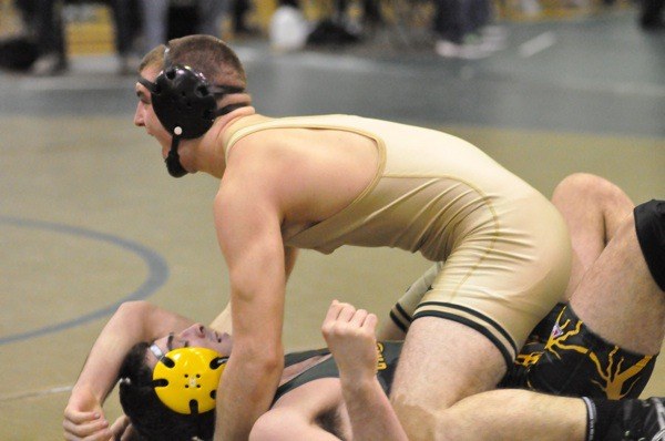 Auburn's James West celebrates his win over Kentridge's Zack Seibel in the 182-pound title match.