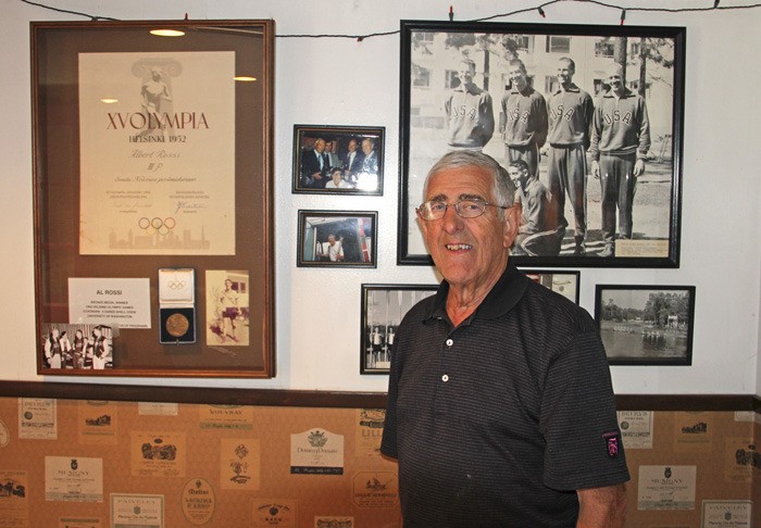 Auburn resident Al Rossi in front of the display containing his bronze medal. Rossi was the coxswain for the US four-man crew rowing team at the 1952 Helsinki Olympics.