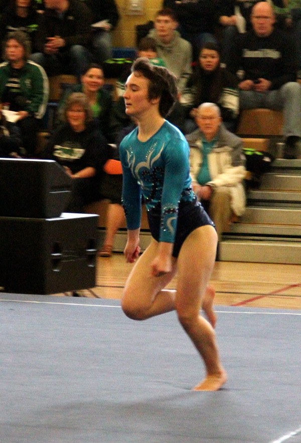 Auburn Riverside's Madi Miller on the floor at the West Central District III 4A meet.