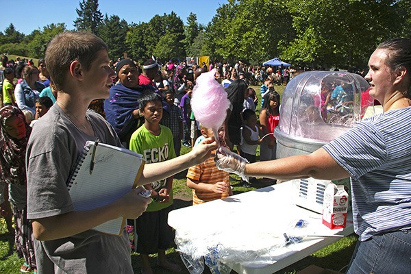 Katy Moran hooks up Auburnite Cadence Stape with some cotton candy at the Barber's Roundup.