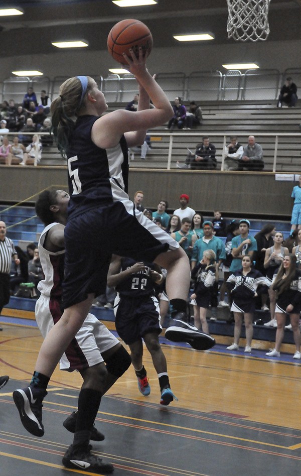 Auburn Riverside's Payton Dunne elevates for a bucket.