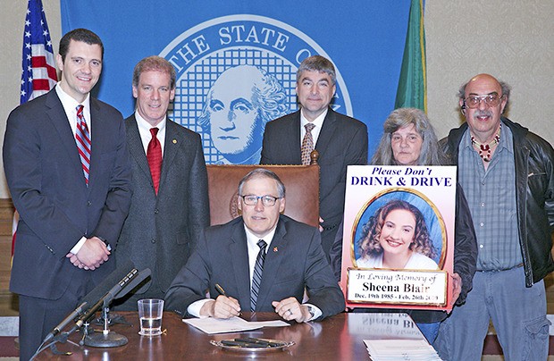 Gov. Jay Inslee signs two bills sponsored by Sen. Joe Fain