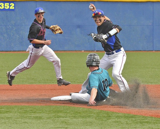 Lions second baseman Matt Anderson gets a force out on Bonney Lake’s Michael Gretler while Auburn Mountainview shortstop Tyler Friis backs him up. The Lions won two games last Saturday