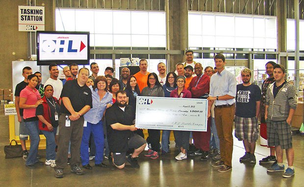 OHL employees presented a hefty check to United Way of King County at its Auburn facility last Friday.