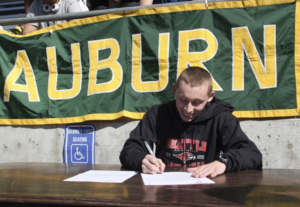 Auburn's Tyler Flannery signs his letter of intent to attend Seattle University.