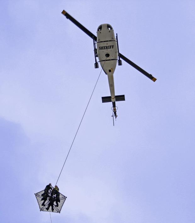 Firefighters and rescuers at work in the Auburn sky.