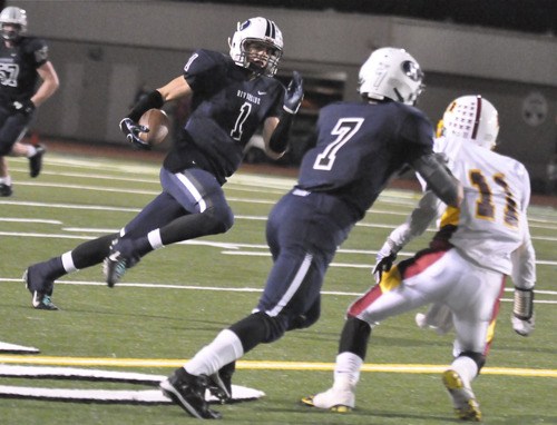 Senior Nick Alexander (No. 1) looks to take advantage of a Kameron Boardway (No. 7) block against Thomas Jefferson.