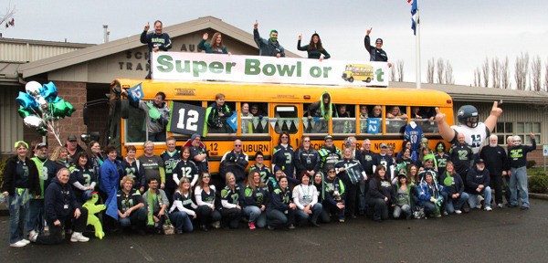 Auburn School District Transportation Department workers pose on their decked out Super Bowl or Bust bus.