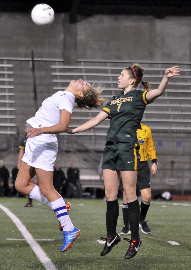 Auburn Mountainview's Madi Clarkson heads the ball in front of a Shorecrest defender.