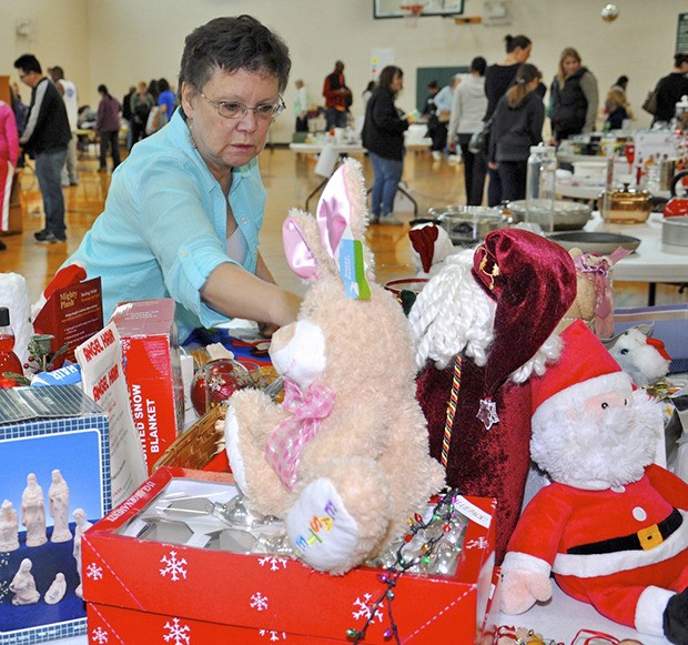 Volunteer Carolyn Beck sells holiday items at the Auburn Valley YMCA’s second annual Garage Sale last Saturday. The sale supports programming for children and families in need from the greater Auburn community.